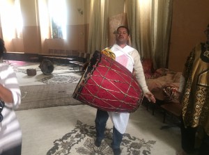 Tour guide plays drums inside of St. George's Cathedral. 